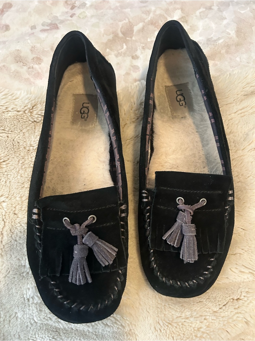 UGG Women’s Black Suede Tassel Moccasins